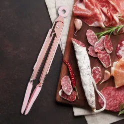 1 st. grilltång i rostfritt stål, non-stick, köttklämma med upphängningshål (rosa)